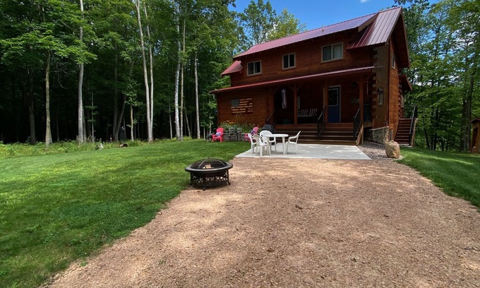 Birchwood Cabin | Family log home nestled in the woods just minutes from trails.