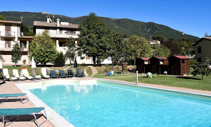 Rivotorto House | Farmhouse in Assisi countryside with five renovated apartments and a swimming pool
