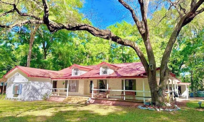 Fort White Cabin | Farmhouse near FL Springs. Cabin, game room, fire-pit, grill, pond, trampoline.