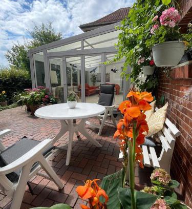 Eystrup Apartment | Ferienwohnung mit WINTERGARTEN in Bahnhofsnähe