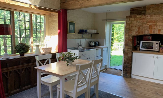 Farthinghoe Cottage | Garden Barn - studio style converted barn with garden