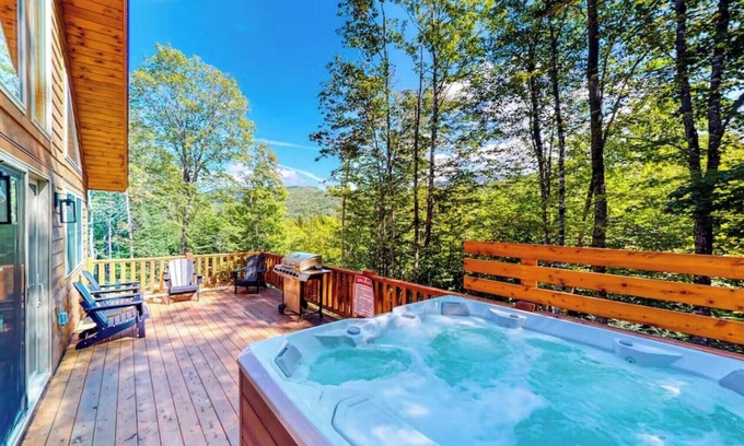 Carrabassett Valley Cabin | Gorgeous dog-friendly cabin with great view, deck, hot tub, & gas fireplace