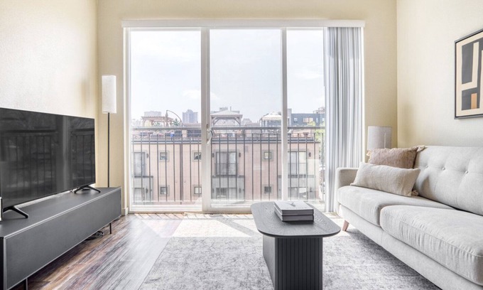 City Park West Apartment | Hip Uptown 1BR w/ W/D & Juliette balconies, near Zoo, by Blueground