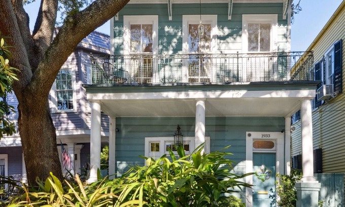 Seventh Ward Apartment | Historic Property With Balcony Lookout into Trees and Pre Civil War buildings.