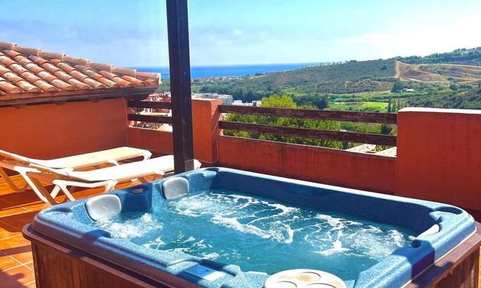 Casares Apartment | Holiday Apartment "Casares Golf Gardens" with Sea View, Shared Pool & Wi-Fi