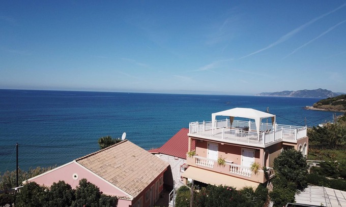 Skala Apartment | Holiday apartment directly at the sea, large terrace, 5 persons | Paramonas, Kor