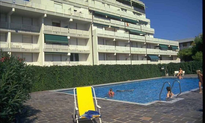 Lignano Sabbiadoro Apartment | Holiday apartment with balcony, internet and pool