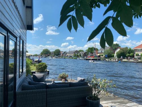Municipality of Aalsmeer House | Holiday home at the water, fire place, boat and SUP rent, near Amsterdam