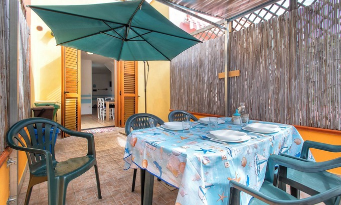 Stintino House | Holiday Home 'Holiday Cala Sant'andrea' with Shared Terrace, Balcony and Wi-Fi