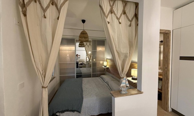 Porto Istana House | Holiday Home 'Le Vele' with Shared Pool, Private Garden and Air Conditioning