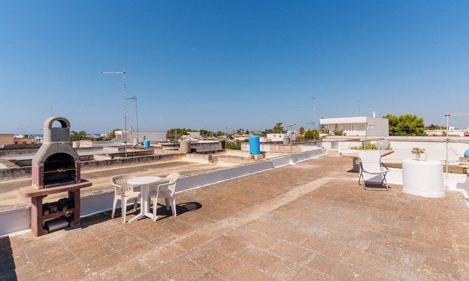 Torre Lapillo House | Holiday Home 'Titti' with Private Terrace, Private Garden and Air Conditioning