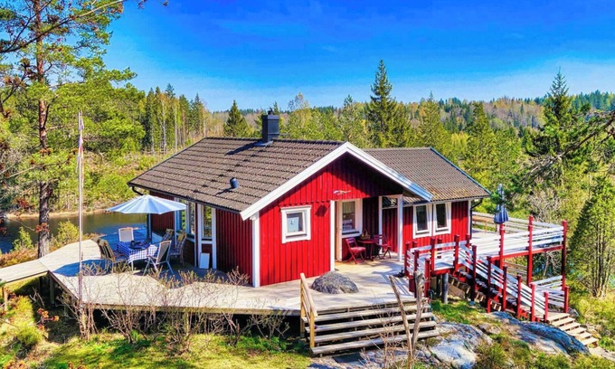 Tived House | Holiday home Tived - directly on lake, sauna, boat, hot tub