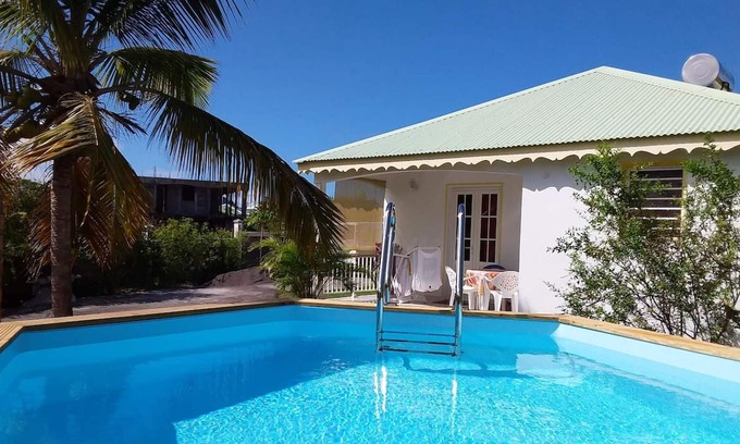Damencourt House | Homerez - House for 5 ppl. with shared pool, garden and terrace at Le Moule