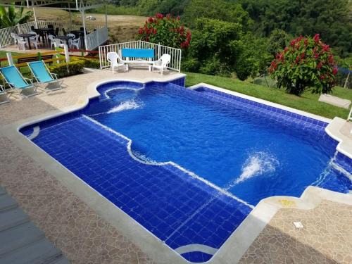 Calarca House | Hotel Chalet San Juan de Ticlan