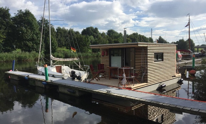 Rustersiel Boat Rental | Houseboat HT 5; with fireplace for 2-3 persons in an idyllic location of Wilhelmshaven