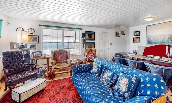 Marvel House | Idyllic rural home with private pond, river access, pool, patio, & covered decks