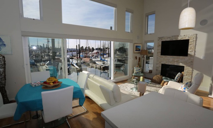Lower Lonsdale Boat Rental | Immerse yourself in a classy & cozy, top level Floating Home! Pets welcome.
