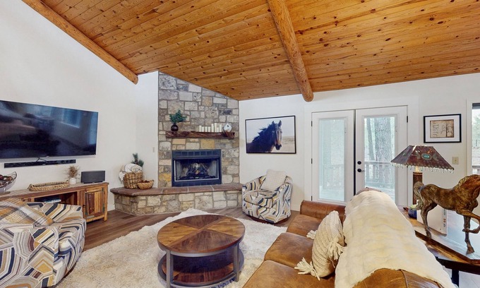 Pinetop House | Immerse yourself in the charm of this delightful cabin tucked among the pines