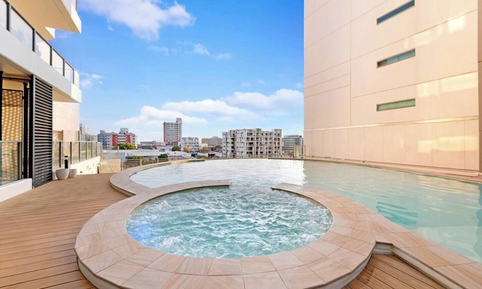 Darwin City Centre Apartment | Inner Bloom Tropical Chic in the CBD with Pool
