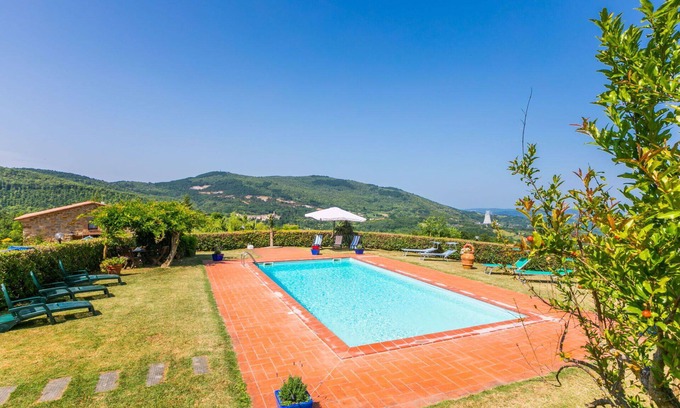 Castelnuovo di Val di Cecina Apartment | Cosy apartment for 12 guests with pool, A/C, WIFI, TV, patio and pets allowed