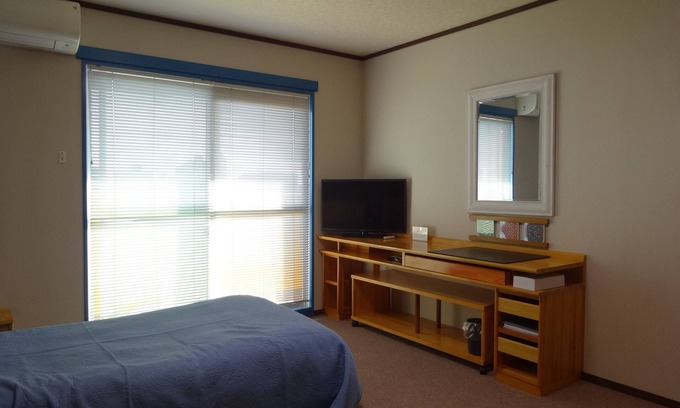 Ikuno Apartment | It has a kitchen, closet, shoe closet, washing machine, balcony and parking space. Clothes can be dried on the balcony, or room-dried. The 46 sq. m. of space is ideal for long-term stays.