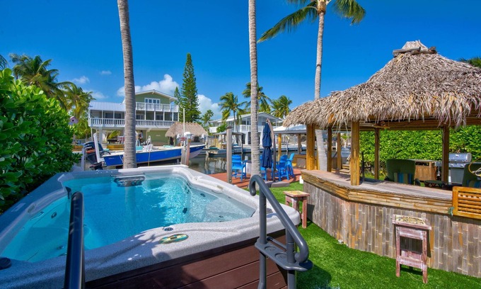 Twin Lakes House | Key Largo Canalfront Home w/Boat Lift, Swim Spa, Tiki Hut & Game Room