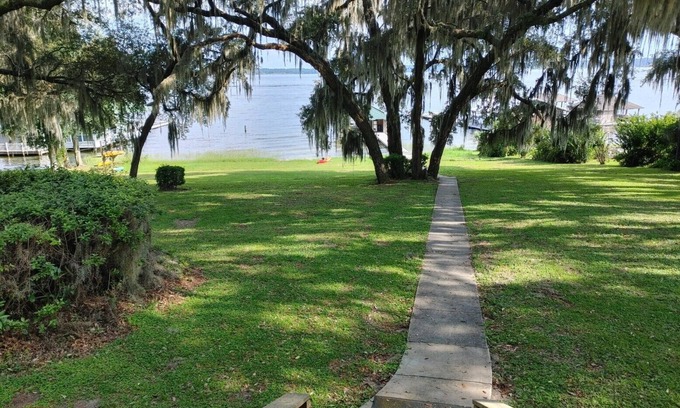 Starke House | Kingsley Lake Home w wide lawn, dock, central air, 4 kayaks. Near Camp Blanding