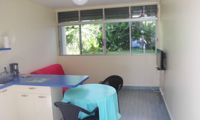Saint-Claude House | Kitchen-living room and air-conditioned bedroom, at the foot of La Soufrière.