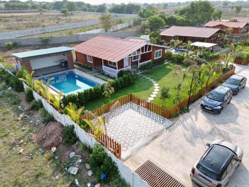Chevella Ski Chalet | Kuku farm stay 3 bedroom wooden cottage with private pool at Moinabad