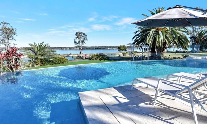 Dora Creek House | Lake Palm Resort Luxury Retreat absolute Waterfront on 3 acres at Lake Macquarie.