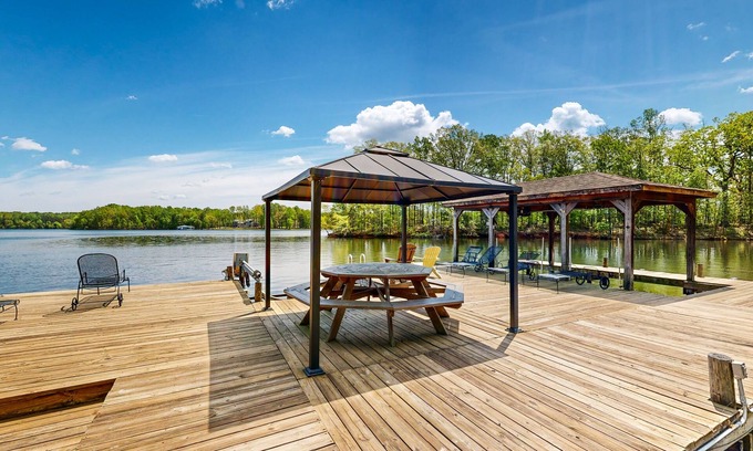 Bumpass House | Lakefront home with two kitchens, a dock, firepit, & pontoon