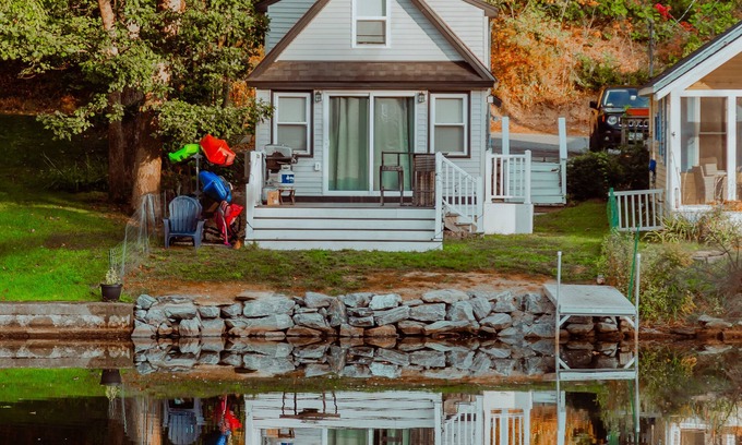 Westminster Cottage | Lakefront; view of ski mountain, firepit, dock, kayaks, paddle board