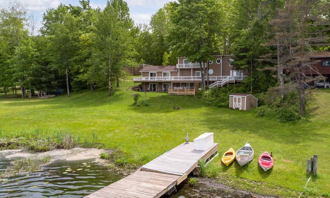 Reed City Cabin | Lakeside Retreat | Hot Tub, Kayak, Arcade, Pontoon