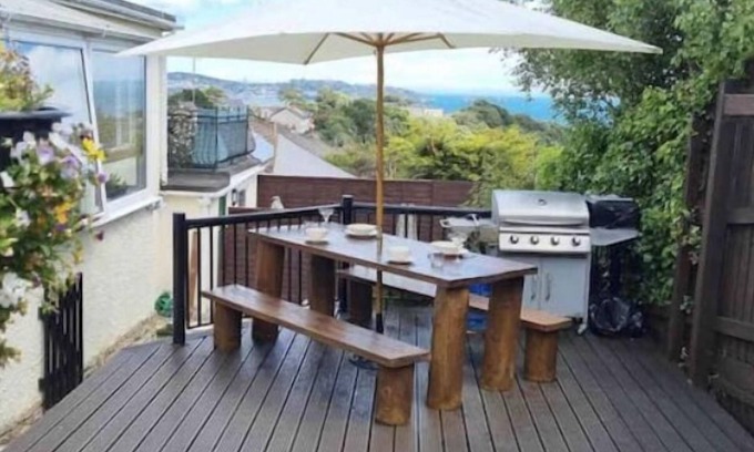Paignton House | Large detached 3 bed bungalow. Great sea views. Hot tub with private gardens.