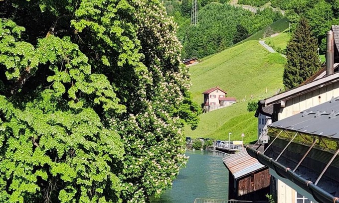 Schwanden Apartment | Large studio in Schwanden with mountains and river. 5 minutes to train station.