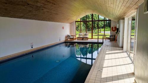 Eglwysbach House | Laurel - pet-friendly cottage with indoor pool, hot tub & panoramic Snowdonia views