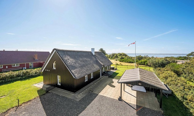West Coast House | Lovely holiday home with fantastic views, fenced grounds, and a Wilderness bath.