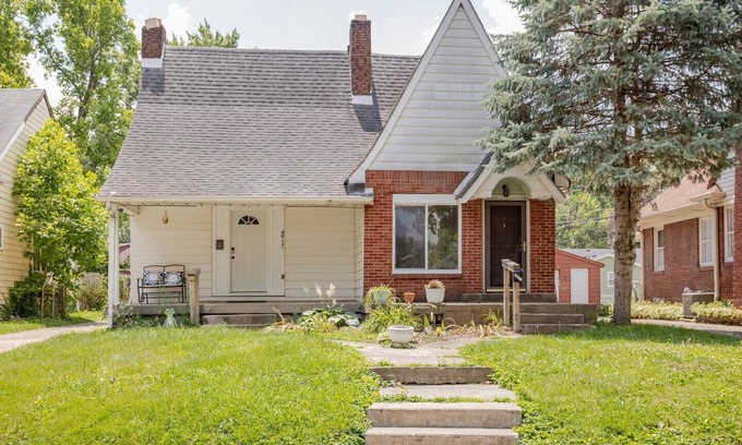 Indianapolis House | Lovely homey pad near Irvington with huge sofa, electric fireplace & porch swing