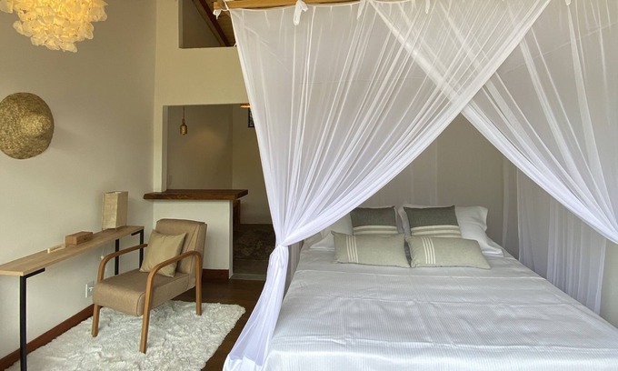 Itamonte House | Luxurious master suite amidst lush nature in the Mantiqueira mountains