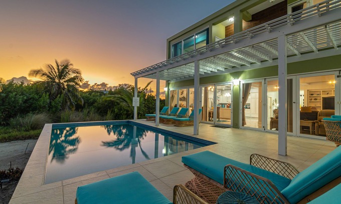 San Pedro House | Luxury Oasis: Serene Beachfront with Pool & Dock