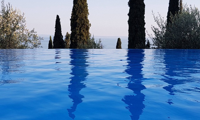 Pulciano Apartment | Modern apartment with Seepanoramablick in a quiet area with large infinity pool