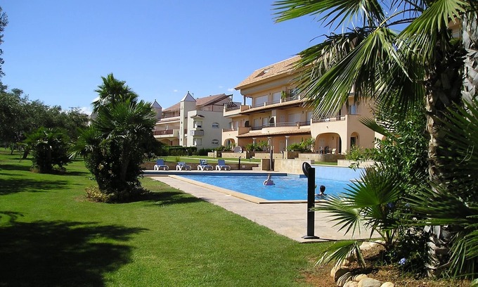 San Jorge House | Modern duplex house overlooking communal pool and gardens at Golf Panoramica.