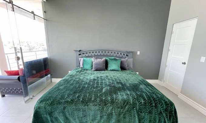 Tequesquitengo House | Modern Lakeside Retreat: Beach Access, All-White Tile, & Stylish Décor