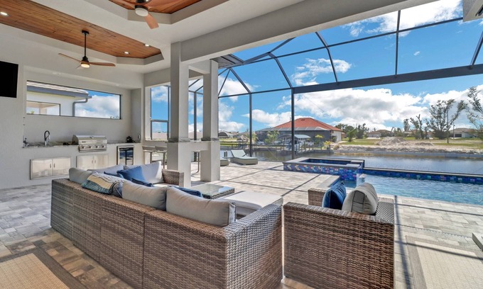 Burnt Store House | Modern & Luxurious Waterfront! Outdoor Space w/Heated Pool/Spa! Over $125 of Free Daily Activities!