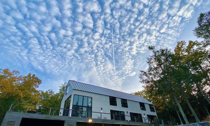 Bath House | Modern waterfront home on a private peninsula, surrounded by stunning water views on three sides