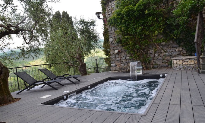 Praelo House | Natural stone house in panoramic position with pool and garden.