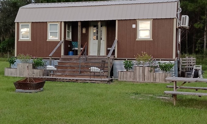 Howey-in-the-Hills House | New luxury Tiny House(s) on 6 acres with horses. Sunsets,fire pit, & Hot tub.