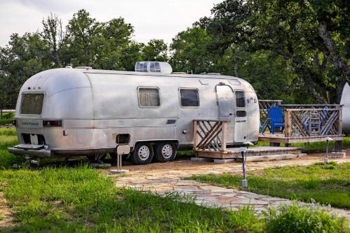 Spicewood House | Newly Renovated Camper with Fresh Decor and Tiny Deck in Texas