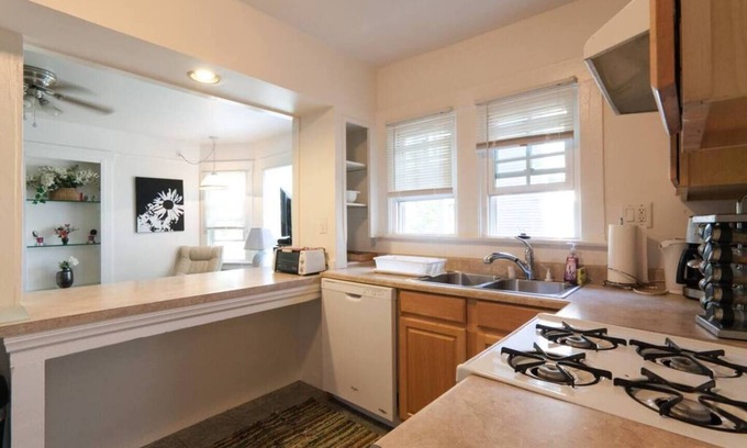 Golden Hill Apartment | Nice 1 bedroom apartment set up with 2 queen beds with one in the living room. The kitchen and bar area still provide ample space and can accommodate up to 5 people.