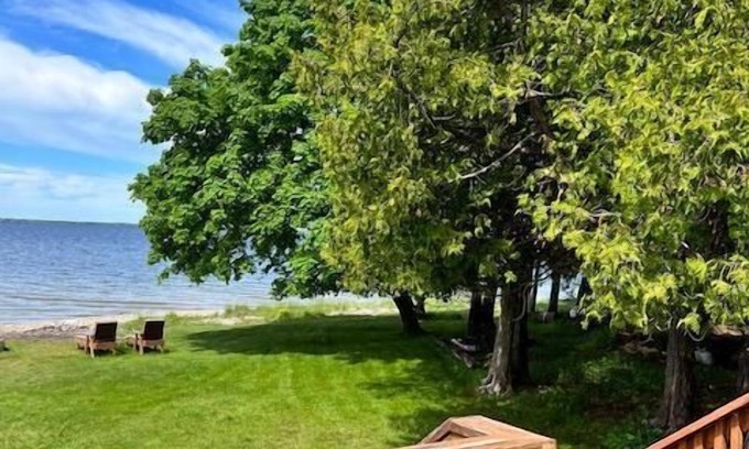 Escanaba Cottage | Noc's Landing: Your Summer Oasis – Cool Breezes & Unforgettable Views